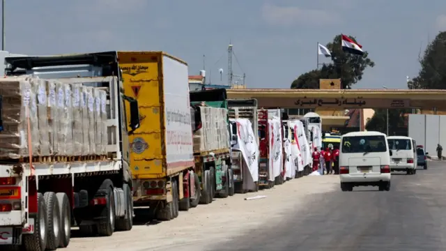 Aid trucks are backed up at the Rafah border crossing