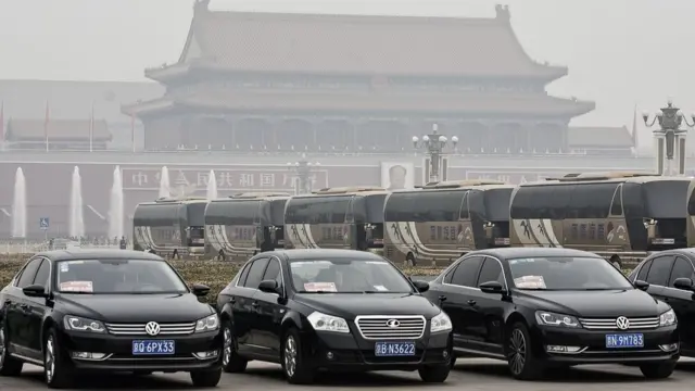 ars and buses for delegates sit parked near the Great Hall of the People in Beijing, China, on Friday, March 4, 2016