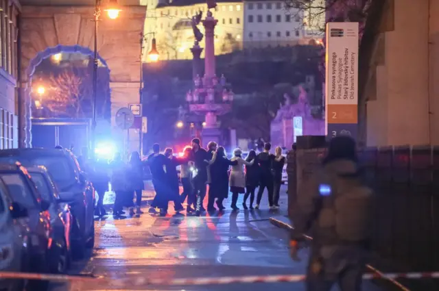 Students of Charles University are being evacuated by police at the location of the shooting on December 21, 2023 in Prague, Czech Republic.
