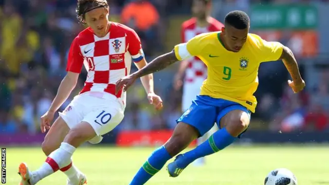 Luka Modric and Gabriel Jesus battle for the ball