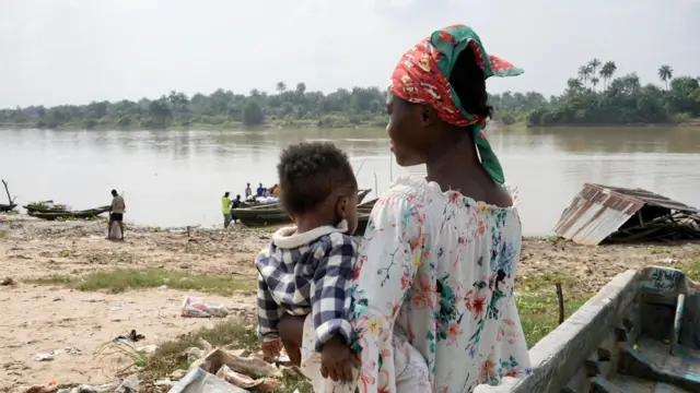 One woman hold one baby