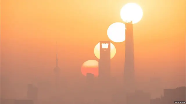An image of the sun at different stages of a sunrise over Shanghai, ਪੁਲਾੜ, ਖਗੋਲ , ਤਸਵੀਰਾਂ, ਫੋਟੋਗ੍ਰਾਫ਼ੀ, ਅਸਮਾਨ
