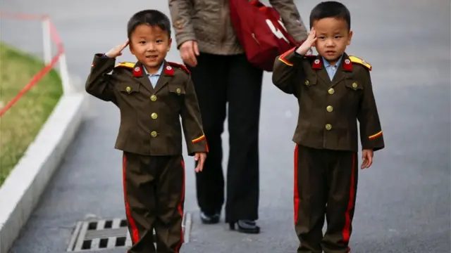 Two children pictured in North Korean military uniforms in Pyongyang, April 2017