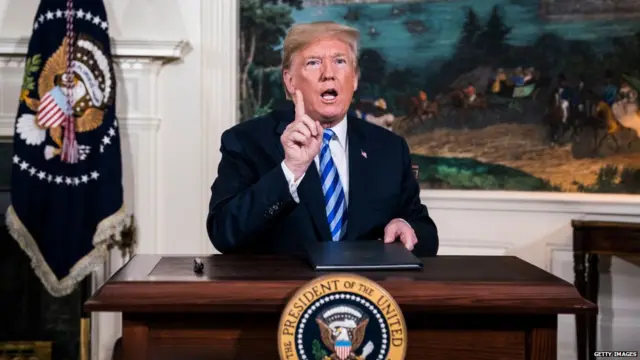 . Trump signs a National Security Presidential Memorandum as he announces the withdrawal of the United States from the Iran nuclear deal