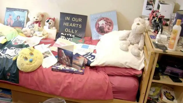 Olly bedroom dey filled wit cards from well-wishers - im teddy Tarzan dey on im bed