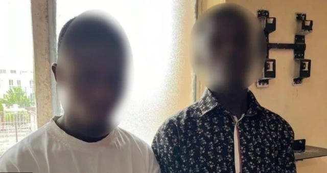 Two blurred Nigerian men