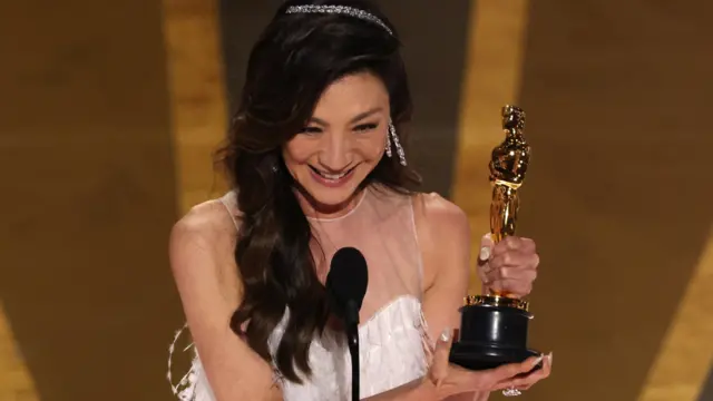 Michelle Yeoh accepts the Oscar for Best Actress for "Everything Everywhere All at Once" during the Oscars show at the 95th Academy Awards in Hollywood, Los Angeles, California