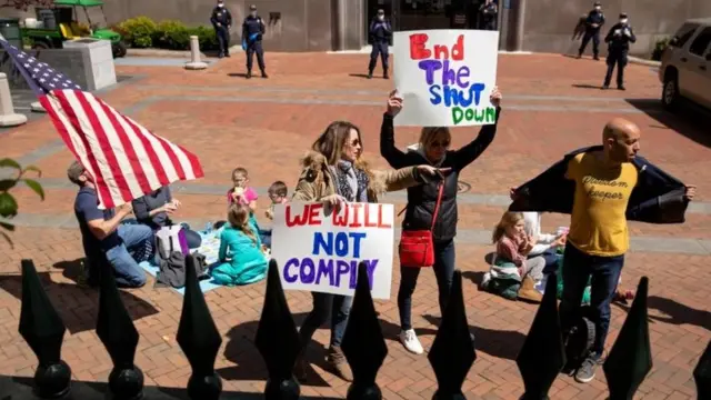 Protesters rally against stay-at-home orders related to the coronavirus pandemic outside Capitol Square in Richmond, Virginia on April 16, 2020