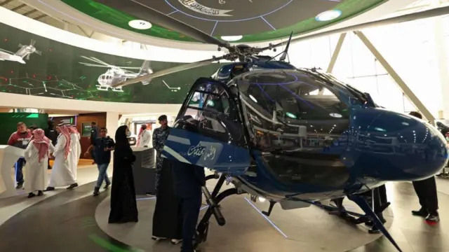 Visitors attend Saudi Arabias first World Defense Show, north of the capital Riyadh, on March 6, 2022. (Photo by Fayez Nureldine / AFP) (Photo by FAYEZ NURELDINE/AFP via Getty Images)