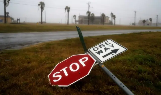 Street signs lie on the ground after winds from Hurricane Harvey escalated in Corpus Christi, Texas, U.S. August 25, 2017.