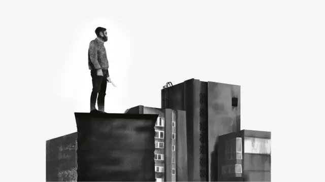 Muškarac na vrhu zgrade