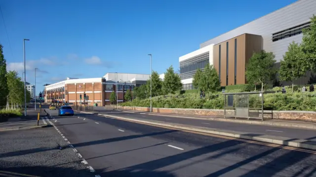 Una imagen generada por computadora de cómo se vería el desarrollo en la antigua fábrica de Vauxhall. Muestra una amplia carretera de cuatro carriles que discurre frente a dos grandes edificios de oficinas o fábricas modernas.