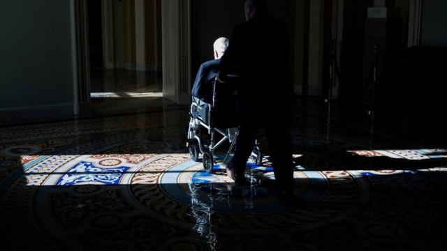 Senator John McCain (R-AZ) uses a wheelchair on Capitol Hill December 1, 2017 in Washington, DC.