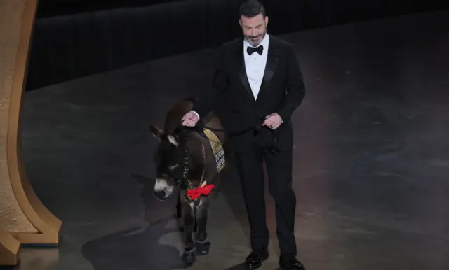 Host Jimmy Kimmel brings out a donkey during the Oscars show at the 95th Academy Awards in Hollywood, Los Angeles, California, U.S., March 12, 2023