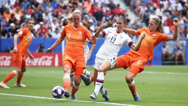 Alex Morgan of the USA battles for possession with Stefanie Van der Gragt and Amouk Dekker of the Netherlands during the 2019 FIFA Women's World Cup France Final match between The United States of America and The Netherlands at Stade de Lyon on July 07, 2019 in Lyon, France.