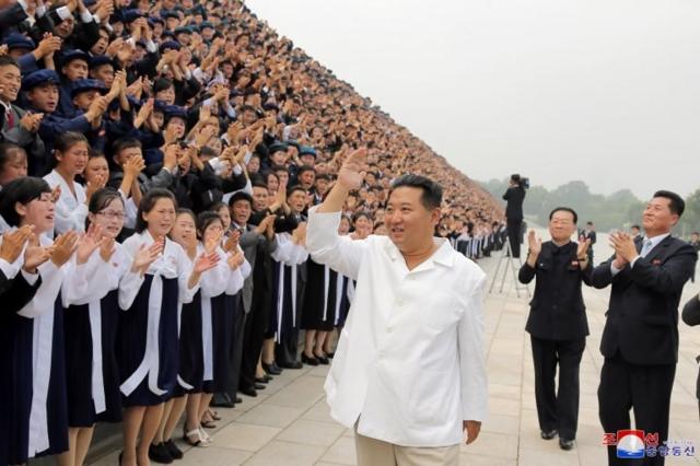 North Korean leader Kim Jong Un waves as he attends a photo session with participants during Youth Day celebrations, in Pyongyang, North Korea, in this image supplied by North Korea"s Korean Central News Agency on August 31, 2021