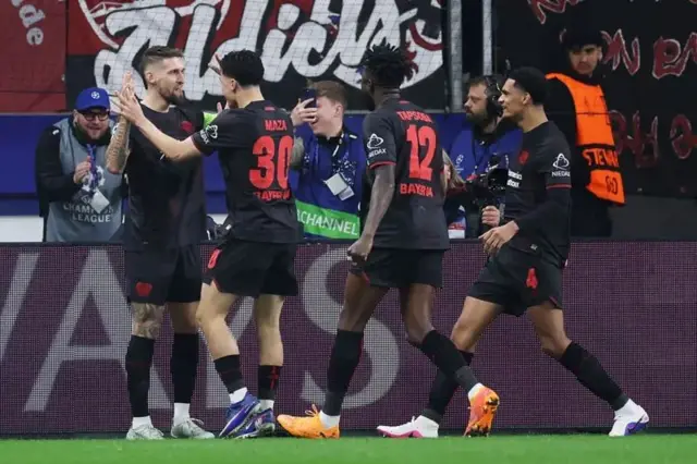 Bayer Leverkusen players celebrate goal against Arsenal
