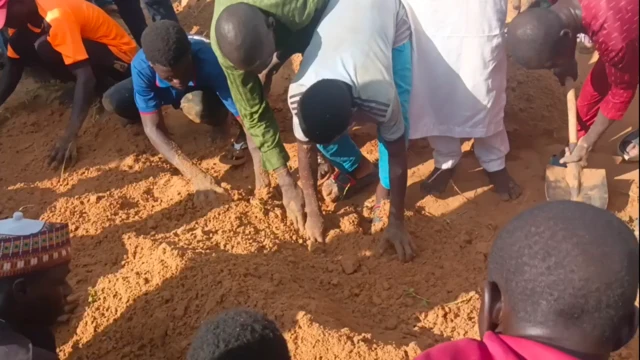 Some young men dey dig ground