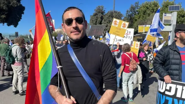 Israeli LGBTQ activist Daniel Johnas protests outside the Knesset in Jerusalem on 29 December 2022