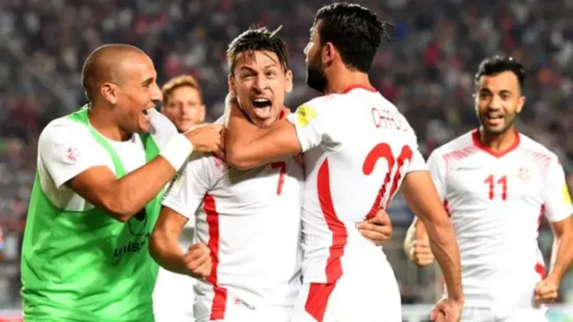 Players from Tunisia team dey jubilate