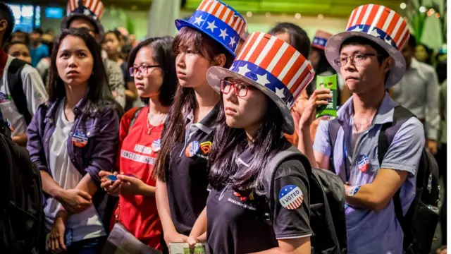 People watch live election results hosted by the United States Consulate General at a convention center on November 9, 2016 in Ho Chi Minh City, Vietnam. Donald Trump"s stunning performance in the US presidential election triggered shock and angst in Asia, where observers fretted over the implications for everything from trade to human rights and climate change
