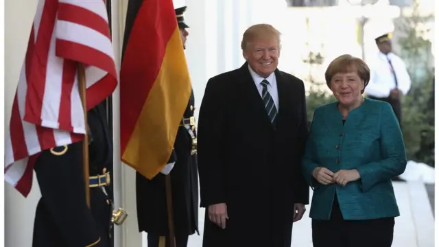 U.S. President Donald Trump (L) greets German Chancellor Angela Merkel as she arrives to the White House on March 17, 2017 in Washington, DC