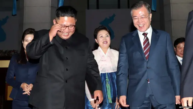 South Korea's President Moon Jae-in (R) leaves with North Korean leader Kim Jong Un (L)