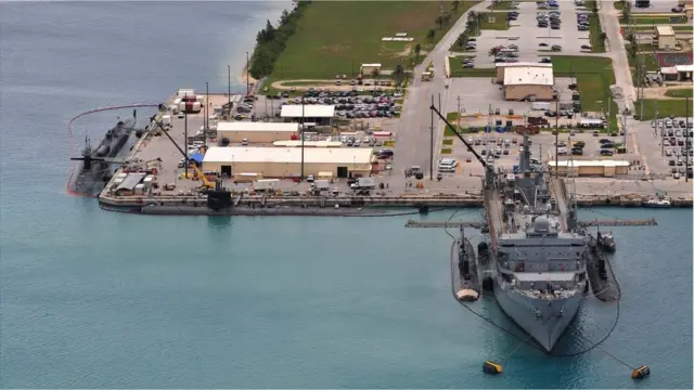 The submarine tender USS Emory S Land AS 39 provides support services to the Los Angeles-class fast attack submarines USS Topeka SSN 754, USS Tucson SSN 770, USS Buffalo SSN 715 and the Ohio-class guided-missile submarine USS Michigan SSGN 727, Polaris Point, Guam. Image courtesy Mass Communication Specialist Seaman Apprentice Samuel Souvannason/US Navy, 2012