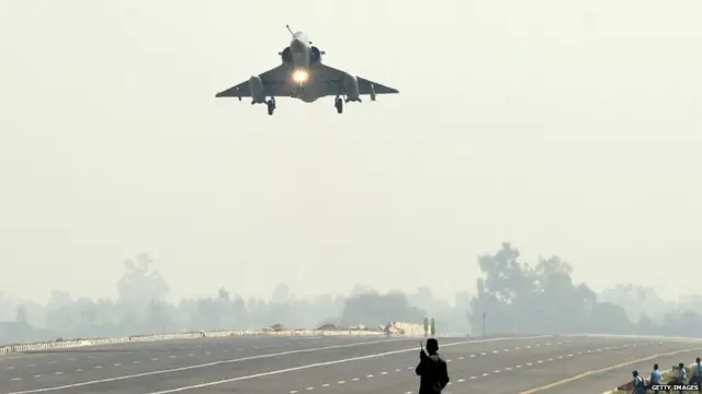 An Indian Air Force Mirage 2000 fighter jet prepares to touch down at the Agra-Lucknow highway during a touchdown operational exercise by the Indian Air Force at Unnao district of Uttar Pradesh on October 24, 2017.