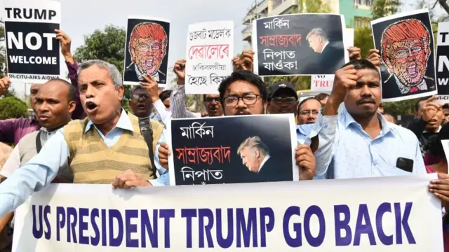 Indian protesters carry placard with message wey dey ask Donald Trump to comot India