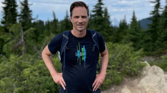 Former Canadian trade negotiator Jason Langrish wearing casual clothing while standing in the great outdoors