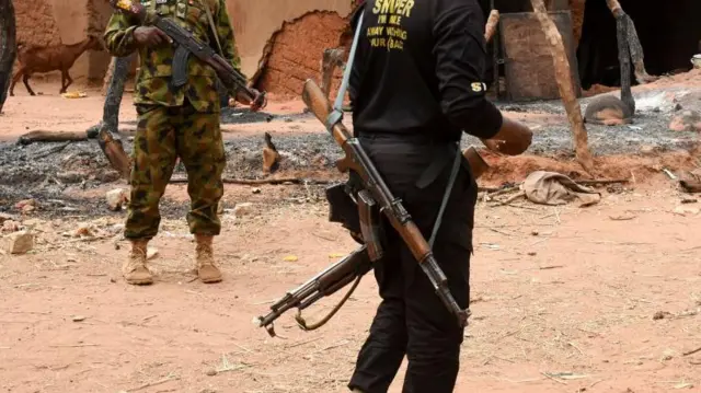 Man hold gun for back