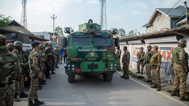 indian paramilitary soldiers cordon off the area after an unknown aircraft crashed in Wuyan near Indian-administered Kashmir's main city of Srinagar.