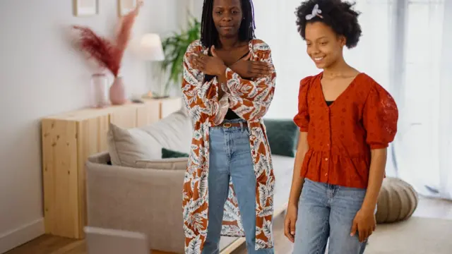 Two women filming a TikTok dance routine