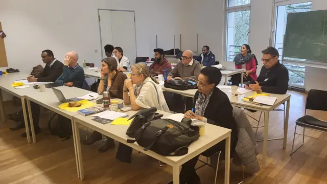 ሐምቡርግ በተደረገ የአማርኛ ቋንቋ ጉባኤ ላይ፤ ዶ/ር ኤቫ (ከፊት ረድፍ ከቀኝ 3ኛ)