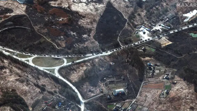 A handout satellite image made available by Maxar Technologies shows Russian ground forces in convoy near of Ivankiv, Ukraine, 27 February 2022.