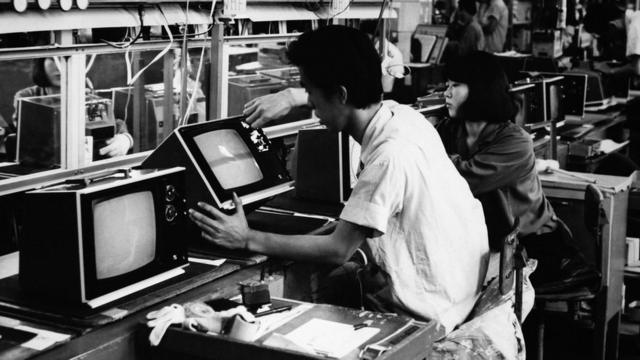 Toshiba Electric workers checking TV sets in Kawasaki in 1970.