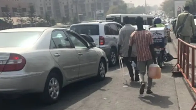 Black marketers don take over di business begin sell fuel for high price sake of di scarcity