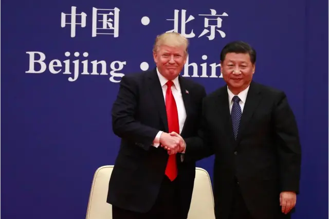 A picture released by Xinhua News Agency shows US President Donald J. Trump (L) and his Chinese counterpart Xi Jinping (R) shaking hands at the US-China Business Exchange event at the Great Hall of the People in Beijing, China, 9 November 2017.