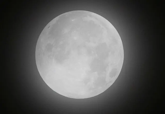 The full moon, known as "Super Blood Moon", rises during a lunar eclipse in Mexico City, Mexico May 26, 2021