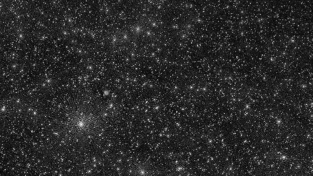 จุดสว่างที่ดูคล้ายดวงดาวเต็มท้องฟ้าในภาพนี้ แท้ที่จริงคือหลุมดำมวลยิ่งยวดที่กำลังแผ่พลังงานอยู่