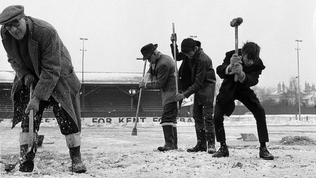 Workmen trying to crack the ice on the Gravesend and Northfleet pitch in preparation for an FA Cup tie with Sunderland in 1963