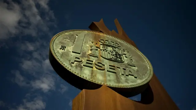 Cartel con una peseta.