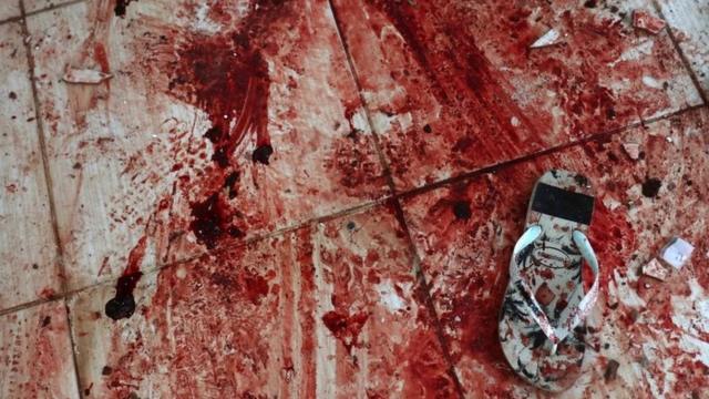 Chinelo sobre chão ensanguentadopoker online amigoscasa no Morro do Fallet