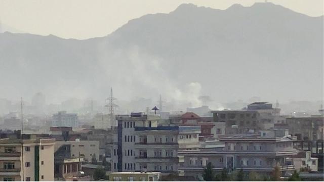 Smoke billows at the scene following an explosion near the Hamid Karzai International Airport in Kabul, Afghanistan, 29 August 2021
