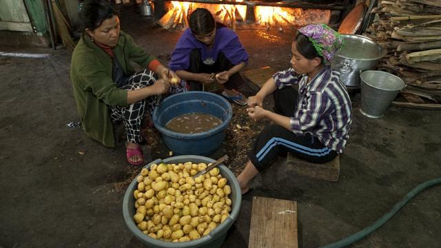 Potatoes are peeled for the afternoon meal on January 30, 2011 in Baktawang,