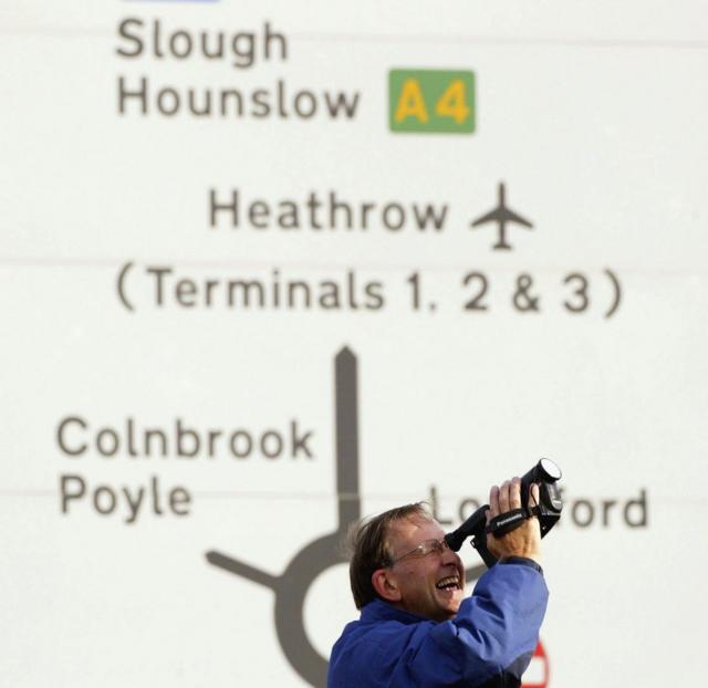 A fan films Concorde at Heathrow Airport