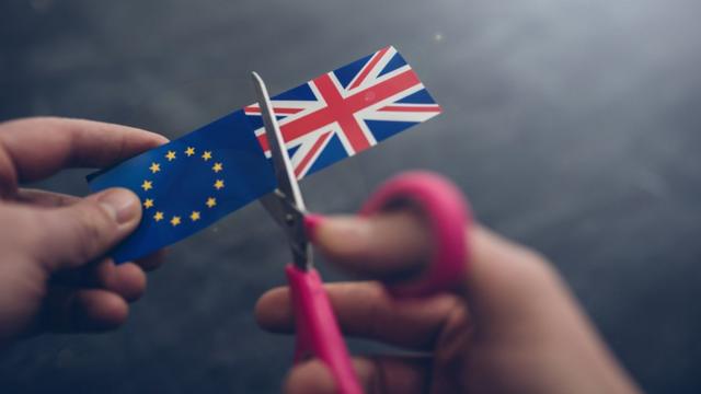 Cutting apart UK and EU flags