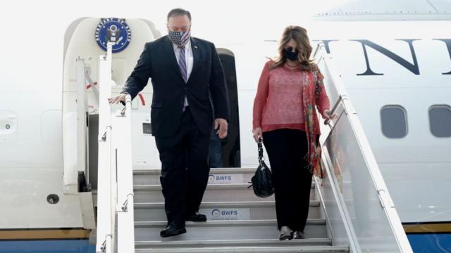 Secretary of State Mike Pompeo, and his wife Susan Pompeo disembark from an aircraft upon their arrival at the airport in New Delhi, India on October 26, 2020