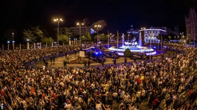 Real Madrid fans celebrate in Cibeles Square in Madrid